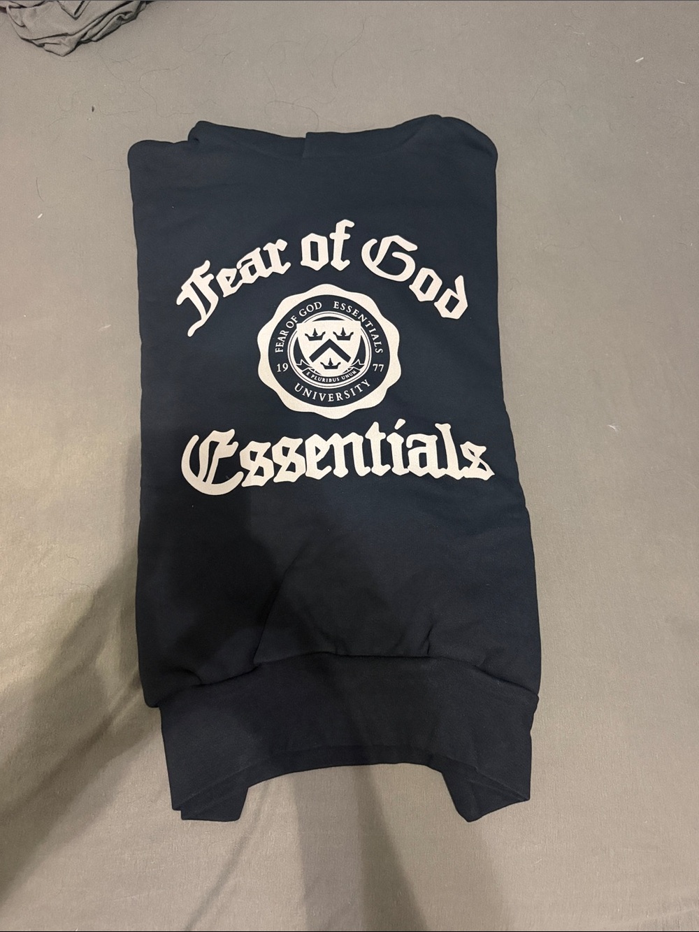 Fear of God Essentials Black Crewneck Sweatshirt with White Collegiate Logo